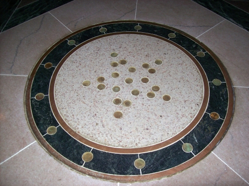 The ring and star pattern in the floor of the Lincoln Bay is made up of 34 Lincoln pennies.